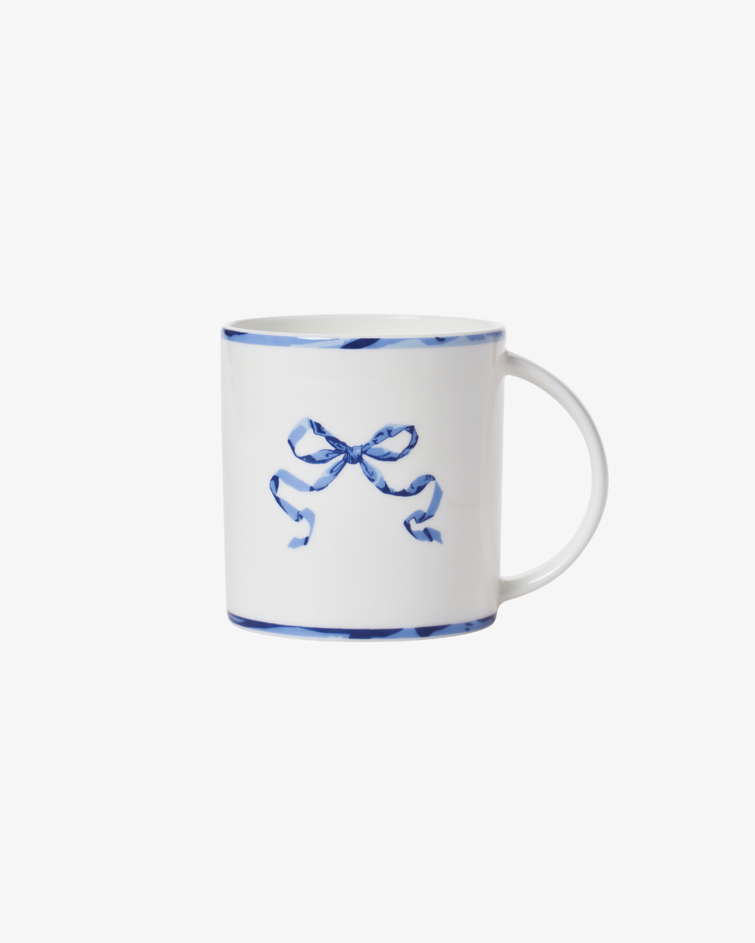 White mug with blue decorative bow on a white background