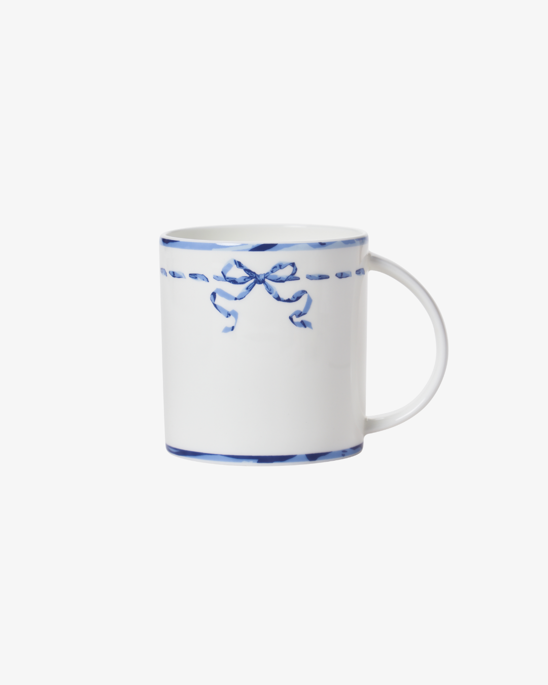 White mug with blue decorative bow design on a white background