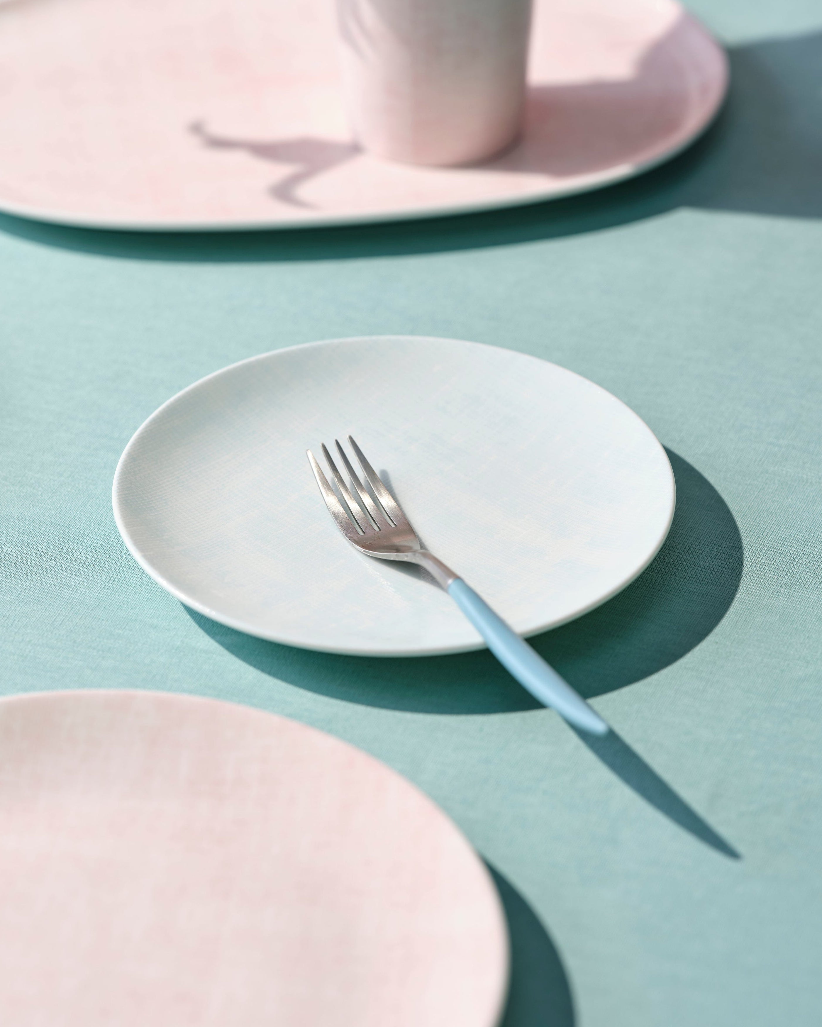 Mint plate with a fork on a surface